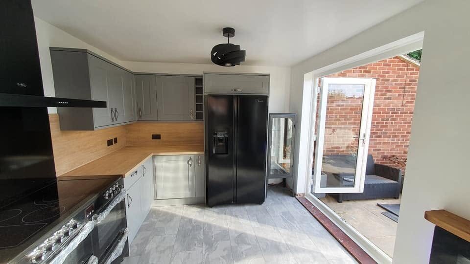 Completed Howdens Chelford Slate Grey kitchen with open access to the garden