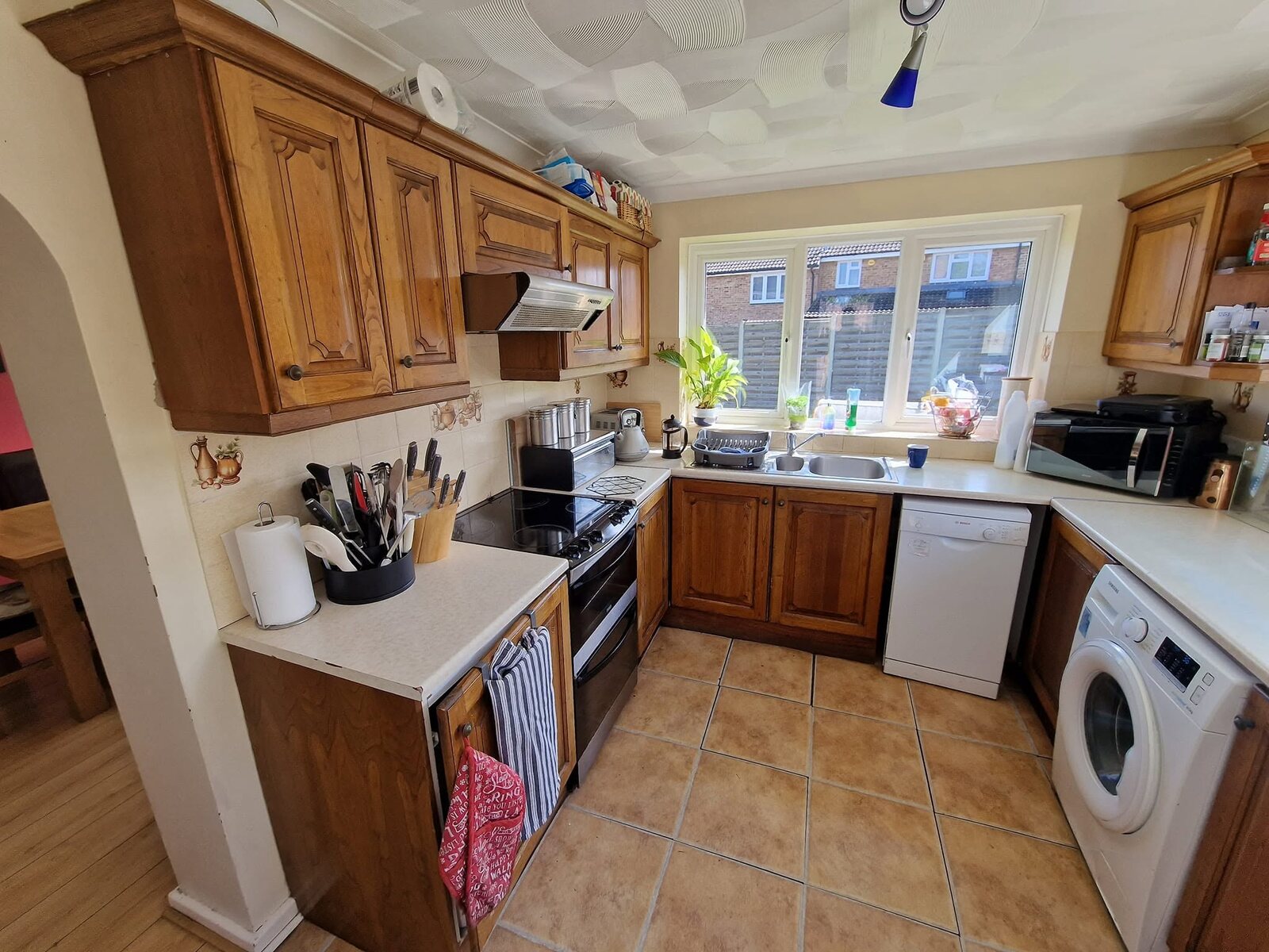 Original timber kitchen before the Chelford White renovation, cooking side
